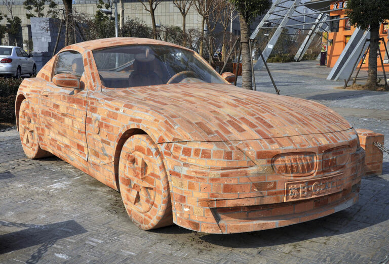 In this Tuesday, Jan. 11, 2011 photo, a model of a BMW Z4 sports car made from bricks is on display in Jiangyin, Jiangsu province, China. The bricks car weighs 6.5 tons designed by Chinese artist Dai Geng. Dai spent more than a year cementing the brick blocks together then carved into a BMW Z4 model. (AP Photo/Color China Photo) CHINA OUT