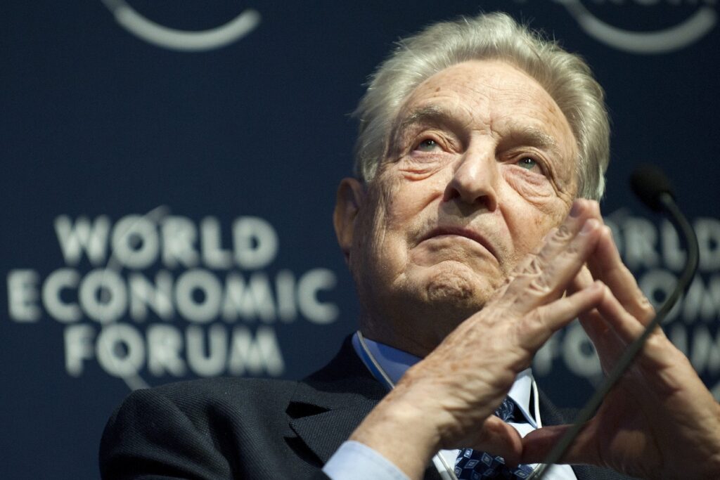 George Soros, right, Chairman of Soros Fund Management speaks before a panel session at the 41st Annual Meeting of the World Economic Forum, WEF, in Davos, Switzerland, Thursday, January 27, 2011. The overarching theme of the World Economic Forum, WEF, annual meeting is 