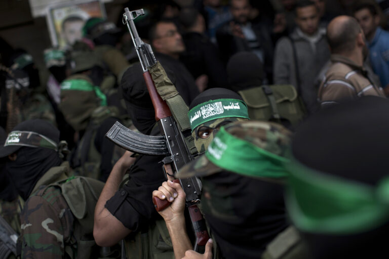 Hamas militants of the Izzedine al-Qassam Brigades attend the funeral of Hamas member Joudeh Shamallah in Gaza City, Saturday, Nov. 24, 2012. According to family members, Shamallah was badly injured during the latest Israeli-Hamas fight and died from wounds Saturday. (AP Photo/Bernat Armangue)