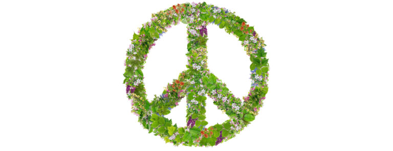 Green Peace symbol abstract collage made from fresh spring branches plants  and  flowers. Isolated