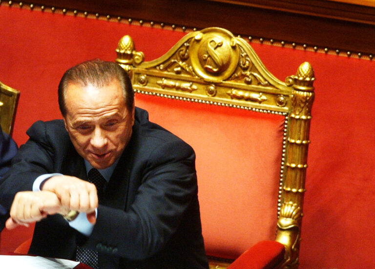 Italian Premier Silvio Berlusconi crosses his arms during a confidence vote at the Italian Senate in Rome, Thursday, April 28, 2005. Berlusconi's new government won a vote of confidence in the Italian Senate, a day after winning approval in the lower chamber house of parliament. (AP Photo/Gregorio Borgia)