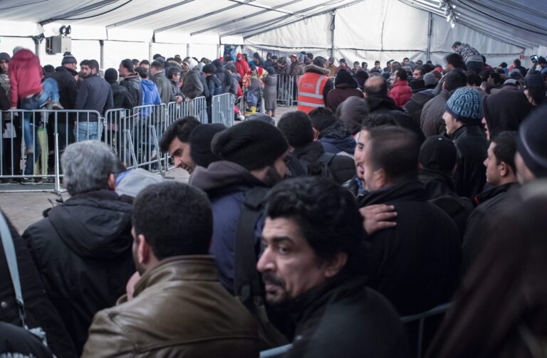 epa05060766 Refugees wait in line in front of the State Office for Health and Social Affairs (LaGeSO) in Berlin, Germany, 09 December 2015. Refugees can get registered or receive initial support services at the office in Berlin. German industry leaders on 08 December 2015 called on lawmakers to facilitate the integration of refugees in the face of a looming labour market shortfall linked to the country's declining birthrate. EPA/MICHAEL KAPPELER