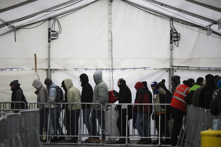 Migrants and refugees line up at the central registration center for refugees and asylum seekers LaGeSo (Landesamt fuer Gesundheit und Soziales - State Office for Health and Social Affairs) LaGeSo during freezing temperatures in Berlin, Germany, Monday, Jan. 4, 2016. (AP Photo/Markus Schreiber)