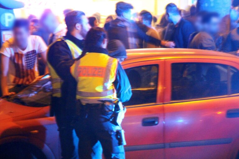 epa05089573 A photo made available on 06 January 2016 of a man (C) being led away by police officers at the main train station in Cologne, Germany, early 01 January 2016. A wave of sexual assaults in the city centre on New Year's Eve has left German authorities and the public reeling. Female victims had reported to police that men had been operating in small groups of around five, singling out the women and forming a circle around them in order to sexually assault them and steal their belongings. The victims had said the perpetrators were among a group of about 1,000 men who looked as if they were of 'Arab or North African descent,' police said. The German government on 05 January condemned the series of sexual assaults on New Year's Eve in Cologne, but warned against scapegoating refugees. (ATTENTION Editors: Faces blurred by source) EPA/MARKUS BOEHM