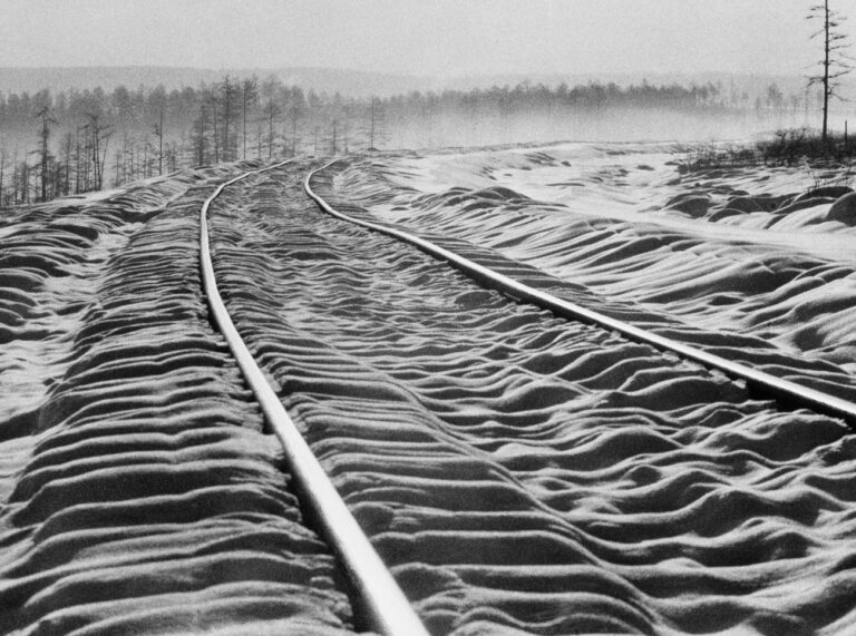 Snow ripples over railroad ties between the curving rails on the new Siberian railroad known as the Bailkal-Amur Mainline (BAM), in the far east of Russia, in 1978. The new line, which runs roughly north and south, will connect with the Trans-Siberian Railway and open up Siberia's far east for the exploration of its vast mineral wealth. Exact date and location are unknown. (AP Photo/Boris Yurchenko)