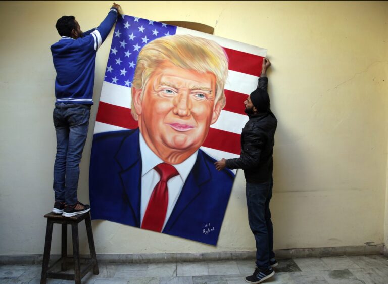 epa05730067 India artist Jagjot Singh Rubal (L), along with his brother, hang a portrait of US President-elect Donald J. Trump on a wall after completing it on the eve of Trump's inauguration ceremony in Washington DC, at his home studio in Amritsar, India, 19 January 2017. Singh says that he has made the portrait to congratulate Trump on becoming the new President of the USA. US President-elect Trump will take the oath of office to be the 45th President of the United States at the US Capitol on 20 January 2017. Trump won the 08 November 2016 election to become the next US President. EPA/RAMINDER PAL SINGH