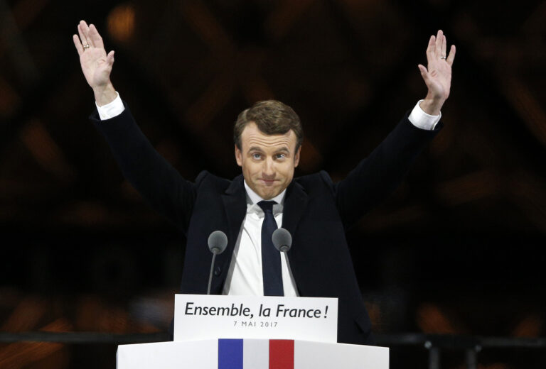 French President-elect Emmanuel Macron gestures during a victory celebration outside the Louvre museum in Paris, France, Sunday, May 7, 2017. Speaking to thousands of supporters from the Louvre Museum's courtyard, Macron said that France is facing an 