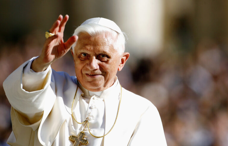 Pope Benedict XVI waves to faithful as he is driven through the crowd prior to his weekly general audience in St. Peter's Square at the Vatican, Wednesday, Oct. 25, 2006. (KEYSTONE/AP Photo/Andrew Medichini)