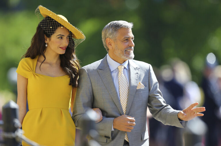 Amal Clooney and George Clooney arrive for the wedding ceremony of Prince Harry and Meghan Markle at St. George's Chapel in Windsor Castle in Windsor, near London, England, Saturday, May 19, 2018. (Gareth Fuller/pool photo via AP)