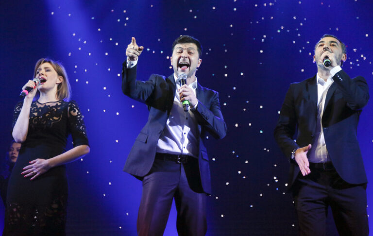 Volodymyr Zelenskiy, center, Ukrainian actor and candidate in the upcoming presidential election, hosts a comedy show at a concert hall in Brovary, Ukraine, Friday, March 29, 2019. Zelenskiy now surging ahead of both Tymoshenko and Poroshenko in the presidential context according to polls. (AP Photo/Efrem Lukatsky)