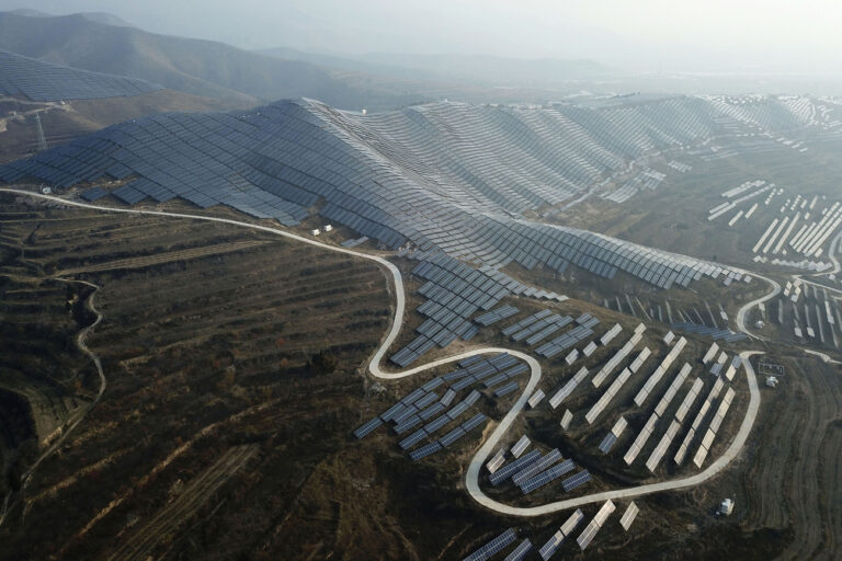 In this Nov. 28, 2019, photo, a solar panel installation is seen in Ruicheng County in central China's Shanxi Province. As world leaders gather in Madrid to discuss how to slow the warming of the planet, a spotlight is falling on China, the top emitter of greenhouse gases. China burns about half the coal used globally each year. Yet it's also the leading market for solar panels, wind turbines and electric vehicles. (AP Photo/Sam McNeil)