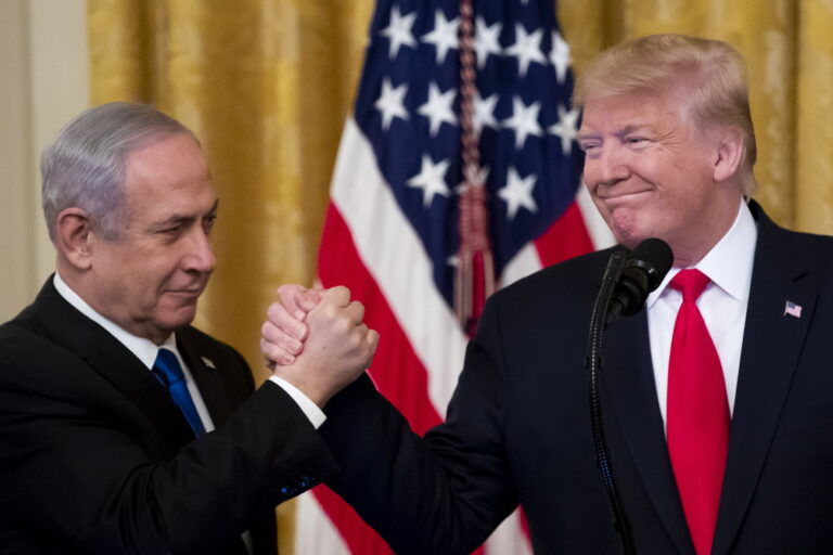 epa08173197 US President Donald J. Trump (R) shakes hands with Prime Minister of Israel Benjamin Netanyahu while unveiling his Middle East peace plan in the East Room of the White House, in Washington, DC, USA, 28 January 2020. US President Donald J. Trump's Middle East peace plan is expected to be rejected by Palestinian leaders, having withdrawn from engagement with the White House after Trump recognized Jerusalem as the capital of Israel. The proposal was announced while Netanyahu and his political rival, Benny Gantz, both visit Washington, DC. EPA/MICHAEL REYNOLDS