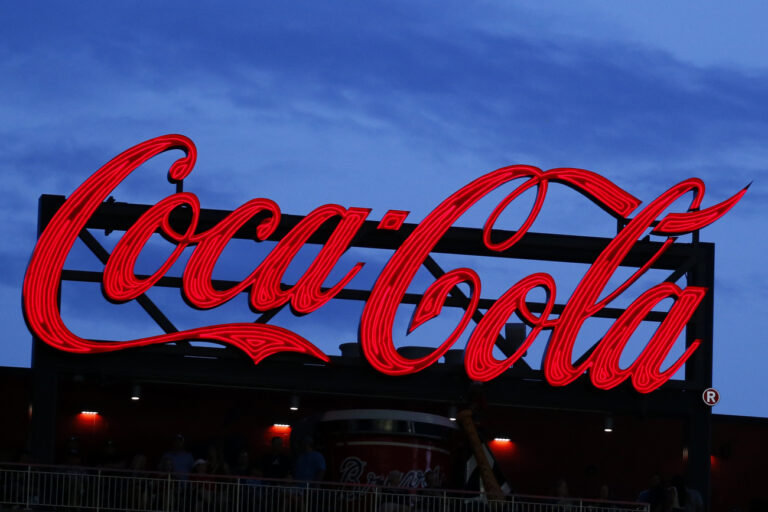 FILE - In this July 20, 2019, file photo a Coca-Cola billboard is shown over left field at SunTrust Park during a baseball game between the Washington Nationals and Atlanta Braves in Atlanta. The Coca-Cola Co. reports financial results on Thursday, Jan. 30, 2020. (AP Photo/John Bazemore, File)