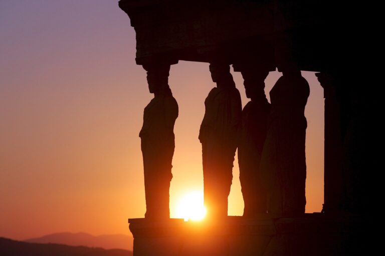 The ancient statues of Karyatis in the Erehtheio of Athens' Acropolis are pictured during the sunset, Athens, 15 July 2007. (KEYSTONE/EPA/ORESTIS PANAGIOTOU)