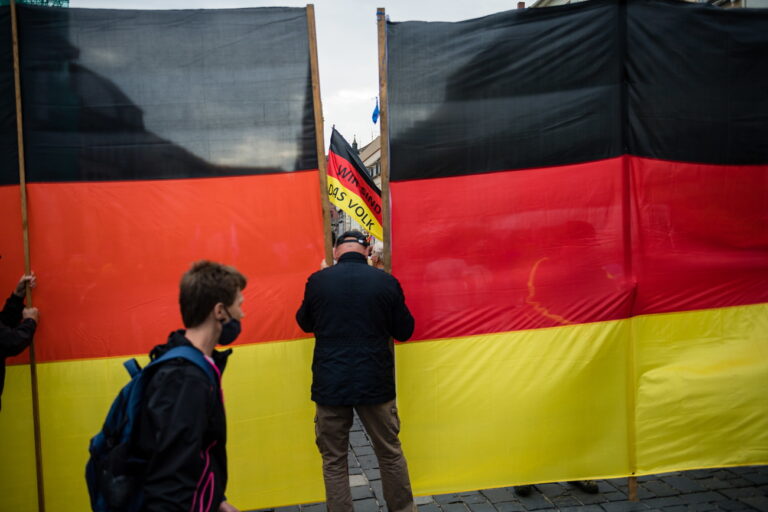 epa08550913 Supporter attend a rally by the German right-wing party 'Alternative fur Deutschland' ('Alternative for Germany' AfD) in Altenburg, Germany, 16 July 2020. According to media reports, Alternative for Germany party (AfD) faction chairman in the regional parliament of Thuringia Bjoern Hoecke and Alternative for Germany party (AfD) faction chairman in the regional parliament of Brandenburg Andreas Kalbitz, will speak to supporters of the party in the evening. EPA/JENS SCHLUETER