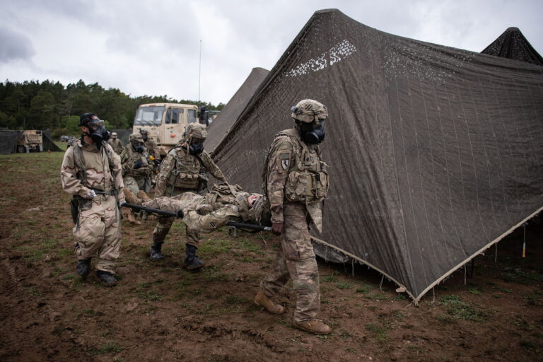 epa08697410 US soldiers evacuate a casualty as they react to a simulated chemical attack in the military exercise ‚Combined Resolve XIV'at the US Army's Joint Multinational Readiness Center in Hohenfels, Germany, 25 September 2020. In the military exercise, forces from the United States, France, Italy, Lithuania, North Macedonia, Poland, Romania, Slovenia and Ukraine train their joint operational capabilties. EPA/PHILIPP GUELLAND