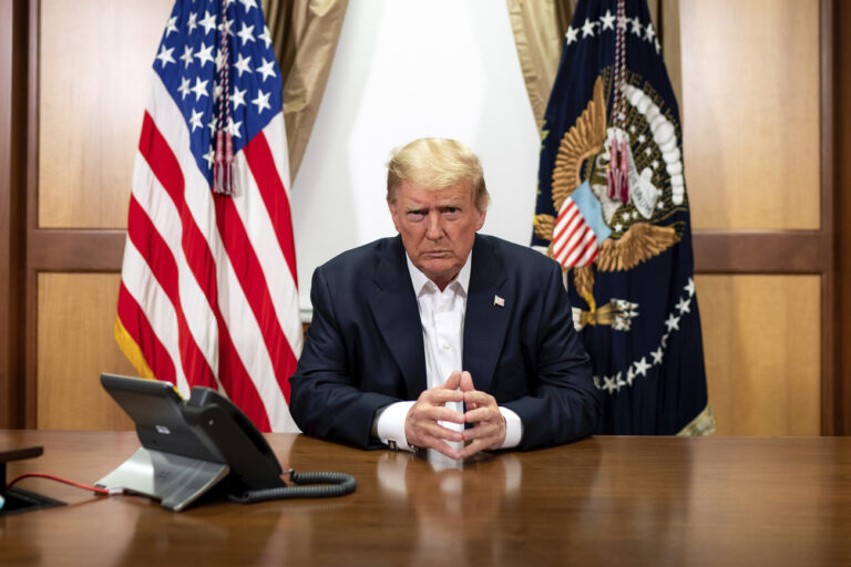 In this image provided by the White House, President Donald Trump listens during a phone call with Vice President Mike Pence, Secretary of State Mike Pompeo, and Chairman of the Joint Chiefs of Staff Gen. Mark Milley, Sunday, Oct. 4, 2020, in his conference room at Walter Reed National Military Medical Center in Bethesda, Md. White House chief of staff Mark Meadows was also in the room, but not pictured, according to the White House. (Tia Dufour/The White House via AP)