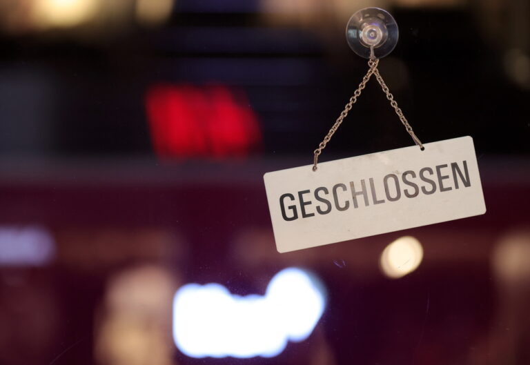 epa08888960 A sign that says closed hangs on a store in the main shopping street during the evening in the city centre of Dortmund, Germany, 16 December 2020. As the number of cases of the COVID-19 disease caused by the SARS-CoV-2 coronavirus is still rising throughout Germany, the government has imposed a second hard lockdown with businesses closing from 16 December on until 10 January 2021. EPA/FRIEDEMANN VOGEL