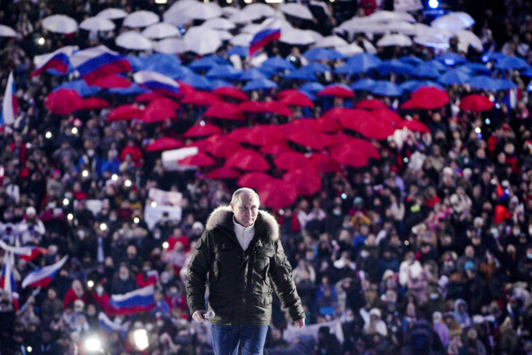 Russian President Vladimir Putin arrives to attend a concert marking the seventh anniversary of the referendum on the state status of Crimea and Sevastopol and its reunification with Russia, in Moscow, Russia, Thursday, March 18, 2021. (Alexei Druzhinin, Sputnik, Kremlin Pool Photo via AP)