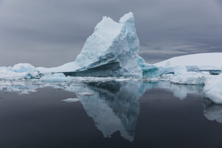 An Iceberg reflection on the water on Sunday, March 10, 2019 in Port Charcot, Antarctica. (Ric Tapia via AP)