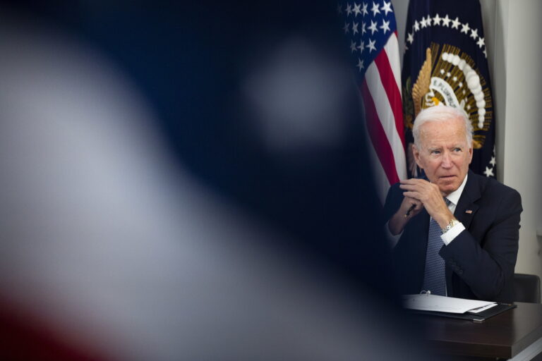 epa09509559 US President Joe Biden is seen behind a US national flag while participating in a meeting with members of his administration and business leaders and CEOs on the need to address the debt limit, in the Eisenhower Executive Office Building on the White House complex in Washington, DC USA, 06 October 2021. The US Treasury has projected a date of the 18th of October to avoid default and warned that failure to raise the debt limit would create 'catastrophic economic consequences'. EPA/MICHAEL REYNOLDS