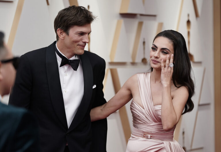 Ashton Kutcher, left, and Mila Kunis arrive at the Oscars on Sunday, March 27, 2022, at the Dolby Theatre in Los Angeles. (AP Photo/Jae C. Hong)
