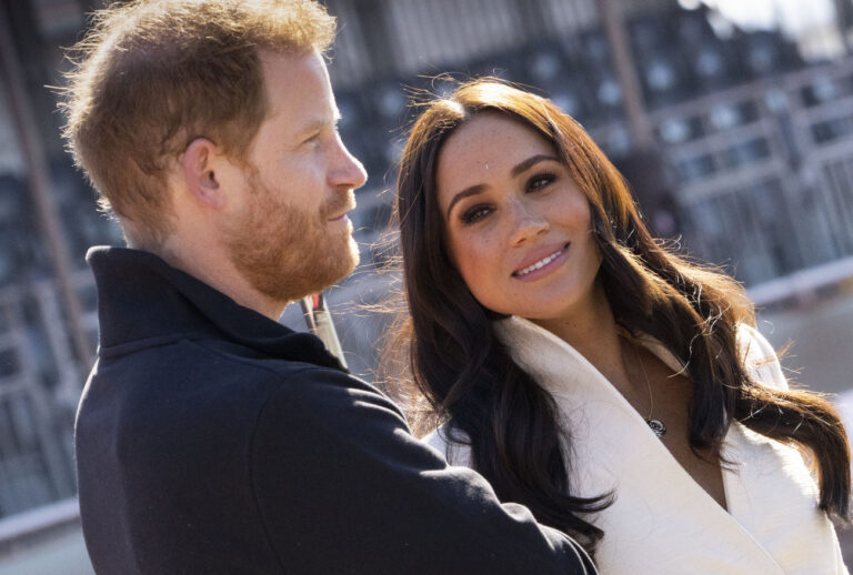 Prince Harry and Meghan Markle, Duke and Duchess of Sussex visit the track and field event at the Invictus Games in The Hague, Netherlands, Sunday, April 17, 2022. The week-long games for active servicemen and veterans who are ill, injured or wounded opened Saturday in this Dutch city that calls itself the global center of peace and justice. (AP Photo/Peter Dejong)