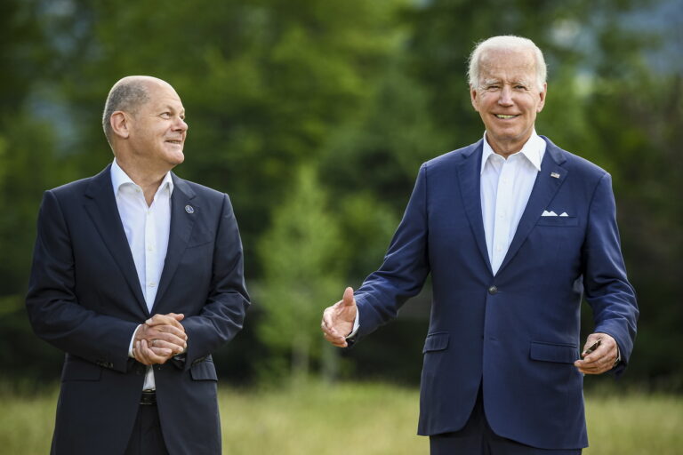 epa10035171 German Chancellor Olaf Scholz (L) and US President Joe Biden (R) pose for family photo with the G7 leaders during the G7 Summit at Elmau Castle in Kruen, Germany, 26 June 2022. Germany is hosting the G7 summit at Elmau Castle near Garmisch-Partenkirchen from 26 to 28 June 2022. EPA/CHRISTIAN BRUNA