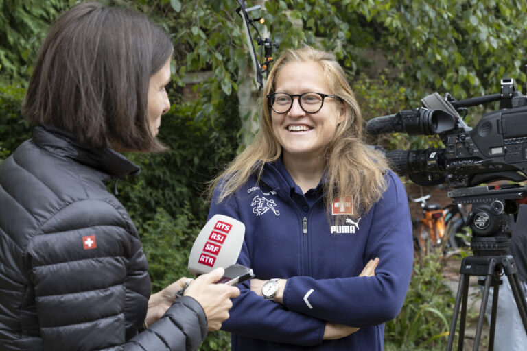 Switzerland's goalkeeper Seraina Friedli talks to the TV reporter in the garden of the hotel Oulton Hall during a press conference, at the UEFA Women's Euro England 2022, in Leeds, England, Friday, July 15, 2022. (KEYSTONE/Salvatore Di Nolfi)