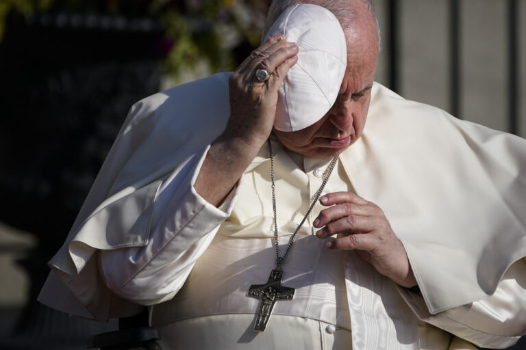 Pope Francis holds onto his skull cap in the wind during his visit to the Citadelle de Quebec, Wednesday, July 27, 2022, in Quebec City, Quebec City, Quebec. Pope Francis is on a 