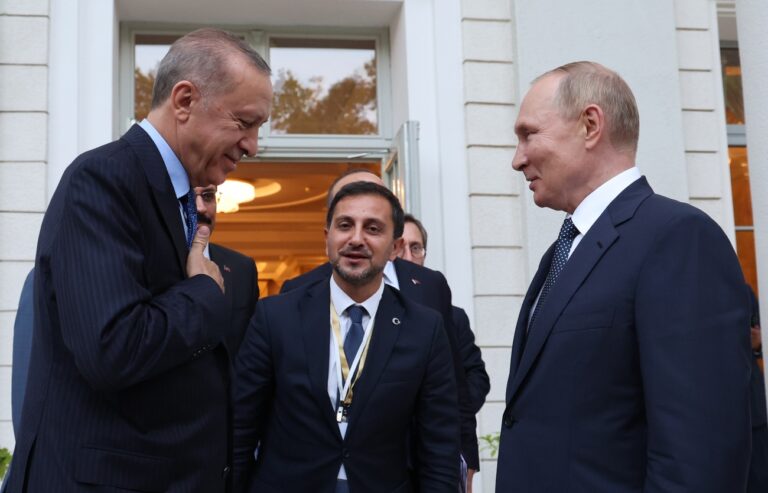 Russian President Vladimir Putin, right, and Turkish President Recep Tayyip Erdogan thank each other after their talks at the Rus sanatorium in the Black Sea resort of Sochi, Russia, Friday, Aug. 5, 2022. Erdogan visited Russia Friday for talks with Russian President Vladimir Putin focusing on a grain deal brokered by Turkey and the U.N., prospects for talks on ending hostilities in Ukraine, the situation in Syria and growing economic ties between Moscow and Ankara. (Vyacheslav Prokofyev, Sputnik, Kremlin Pool Photo via AP)