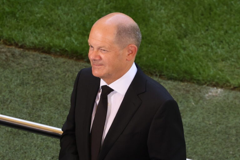 epa10113993 German Chancellor Olaf Scholz gives a TV interview during the memorial ceremony for former Hamburg SV soccer player Uwe Seeler at the Volkspark stadium in Hamburg, northern Germany, 10 August 2022. Former HSV soccer player Uwe Seeler died on 21 July 2022, at the age of 85. EPA/FOCKE STRANGMANN