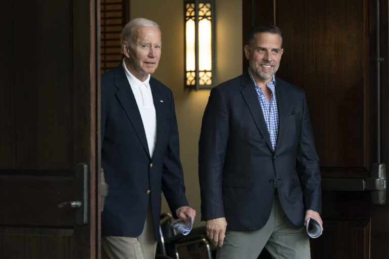 President Joe Biden and his son Hunter Biden leave Holy Spirit Catholic Church in Johns Island, S.C., after attending a Mass, Saturday, Aug. 13, 2022. Biden is in Kiawah Island with his family on vacation. (AP Photo/Manuel Balce Ceneta)