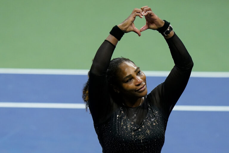 Serena Williams, of the United States, motions a heart to fans after losing to Ajla Tomljanovic, of Austrailia, during the third round of the U.S. Open tennis championships, Friday, Sept. 2, 2022, in New York. (AP Photo/Frank Franklin II)