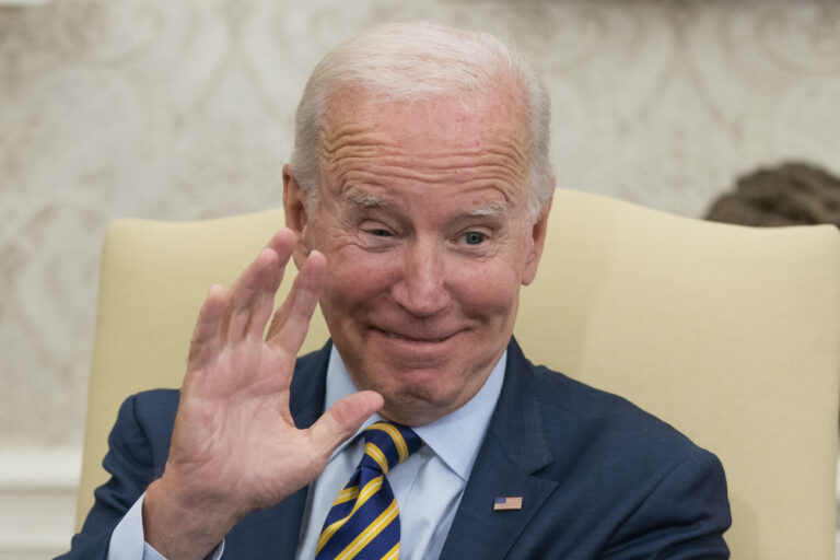 President Joe Biden waves during a meeting with South African President Cyril Ramaphosa in the Oval Office of the White House, Friday, Sept. 16, 2022, in Washington. (AP Photo/Alex Brandon)