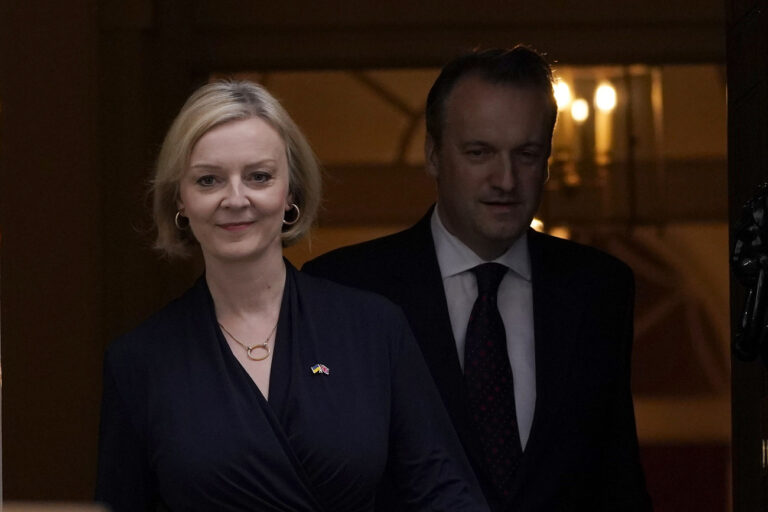 Britain's Prime Minister Liz Truss and husband Hugh O'Leary leave 10 Downing Street to address the media in London, Thursday, Oct. 20, 2022. Truss says she resigns as leader of UK Conservative Party. (AP Photo/Alberto Pezzali)