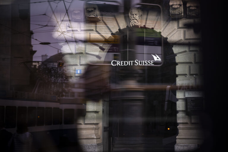 The logo of Swiss bank Credit Suisse is seen trough a window at their headquarters in Zurich, Switzerland on Thursday, October 27, 2022. (KEYSTONE/Michael Buholzer)