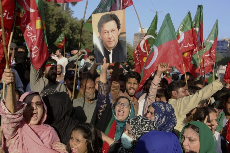 Supporters of former Pakistani Prime Minister Imran Khan's party, 'Pakistan Tehreek-e-Insaf' chant slogans during a protest to condemn a shooting incident on their leader's convoy, in Karachi, Pakistan, Friday, Nov. 4, 2022. Khan who narrowly escaped an assassination attempt on his life the previous day when a gunman fired multiple shots and wounded him in the leg during a protest rally is listed in stable condition after undergoing surgery at a hospital, a senior leader from his party said Friday. (AP Photo/Fareed Khan)