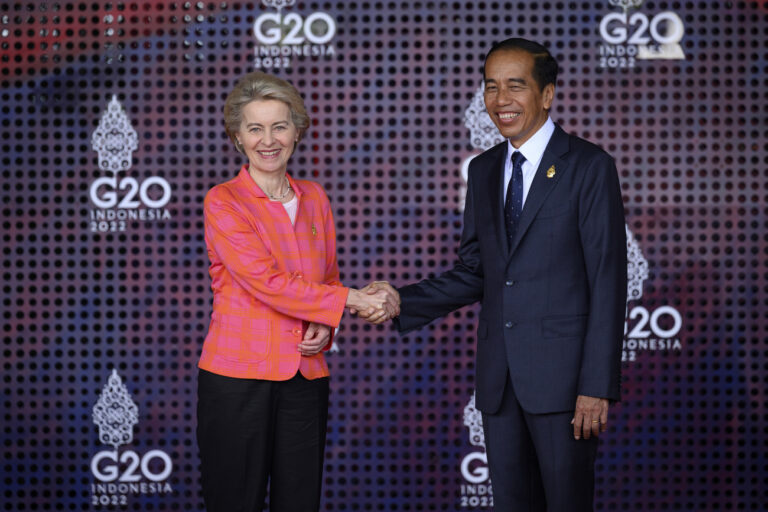 President of the European Commission Ursula von der Leyen is greeted by the President of the Indonesian Republic Joko Widodo, right, during the formal welcome ceremony to mark the beginning of the G20 Summit, in Nusa Dua, Indonesia, Tuesday Nov. 15, 2022. (Leon Neal/Pool Photo via AP)