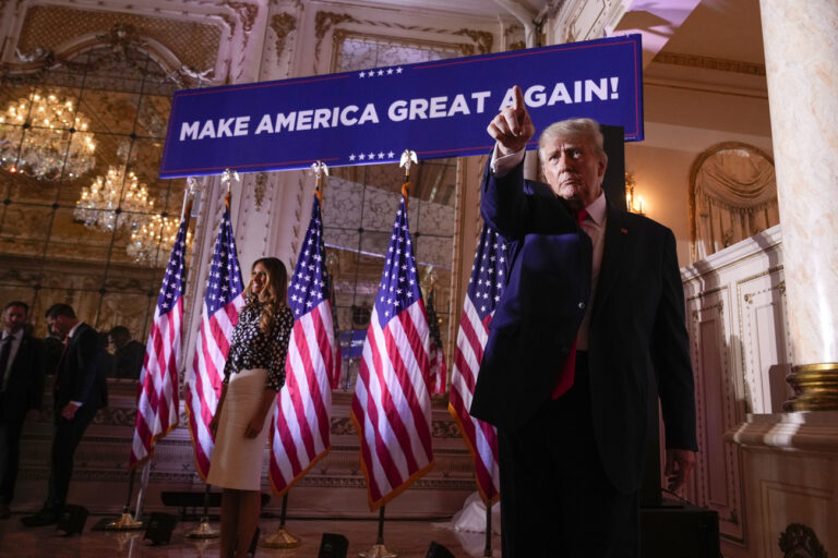 Former President Donald Trump gestures after announcing a third run for president as he speaks at Mar-a-Lago in Palm Beach, Fla., Tuesday, Nov. 15, 2022. Former first lady Melania Trump is at left. (AP Photo/Andrew Harnik)