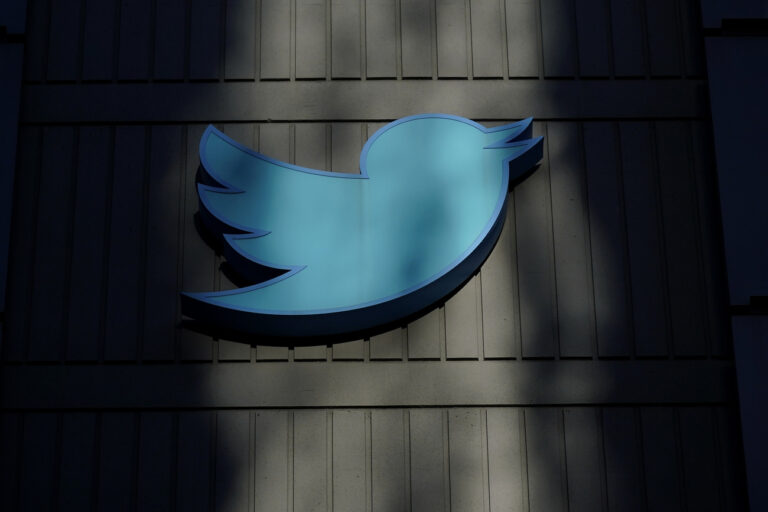 FILE - A sign at Twitter headquarters is shown in San Francisco, Friday, Nov. 18, 2022. Elon Musk's Twitter has dissolved its Trust and Safety Council, the advisory group of nearly 100 independent civil, human rights and other organizations that the company formed in 2016 to address hate speech, child exploitation, suicide, self-harm and other problems on the platform. The council had been scheduled to meet with Twitter representatives on Monday night, Dec. 12. But Twitter informed the group via email that it was disbanding it shortly before the meeting was to take place, according to multiple members. (AP Photo/Jeff Chiu, File)