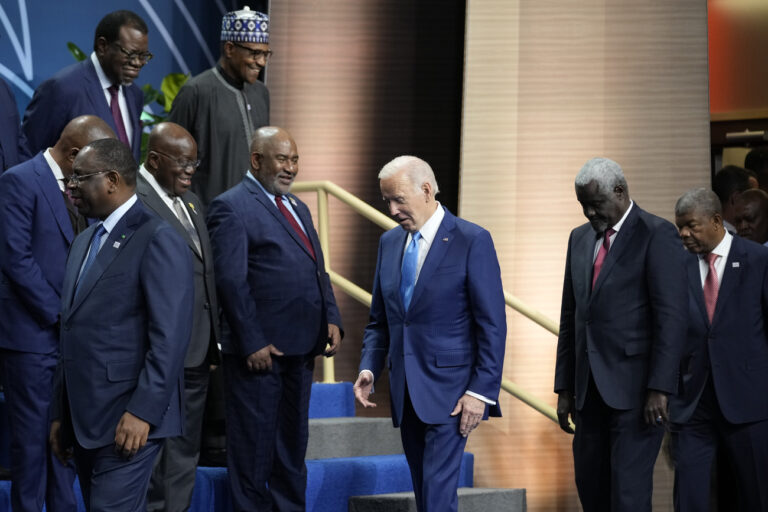 President Joe Biden and other leaders arrive for a family photo during the U.S.-Africa Leaders Summit at the Walter E. Washington Convention Center in Washington, Thursday, Dec. 15, 2022. (AP Photo/Andrew Harnik)