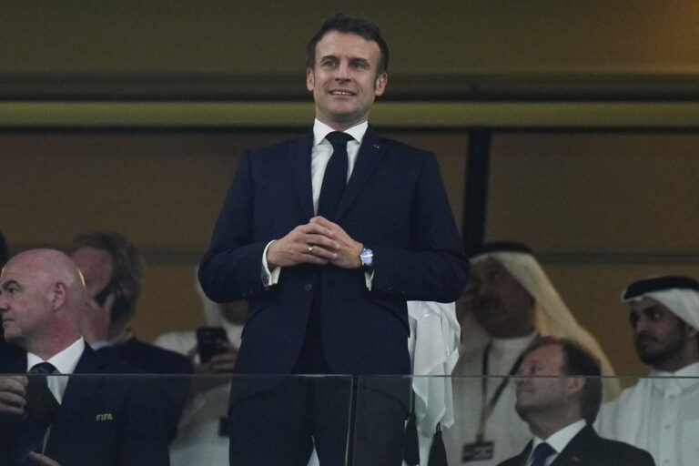 French President Emmanuel Macron i stands on the tribune before the World Cup final soccer match between Argentina and France at the Lusail Stadium in Lusail, Qatar, Sunday, Dec. 18, 2022. (AP Photo/Petr David Josek)