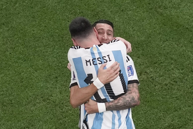 Argentina's Angel Di Maria hugs Lionel Messi who scored his side's first goal during the World Cup final soccer match between Argentina and France at the Lusail Stadium in Lusail, Qatar, Sunday, Dec. 18, 2022. Di Maria scored Argentina's second goal. (AP Photo/Thanassis Stavrakis)
