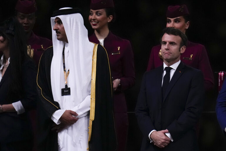 The Emir of Qatar Sheikh Tamim bin Hamad Al Thani and French President arrive for the trophy presentation at the end of the the World Cup final soccer match between Argentina and France at the Lusail Stadium in Lusail, Qatar, Sunday, Dec.18, 2022. (AP Photo/Manu Fernandez)