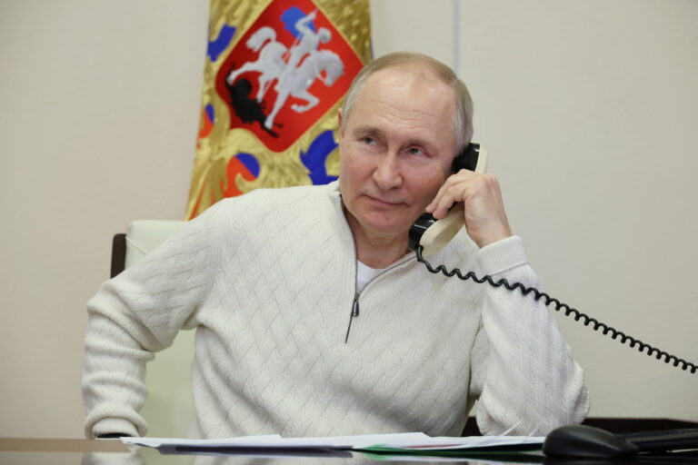 epa10391044 Russian President Vladimir Putin speaks on the phone to seven-year-old David Shmelev from Stavropol Krai region, who took part in the New Year Tree of Wishes nationwide charity campaign, at the Novo-Ogaryovo state residence, outside Moscow, Russia, 05 January 2023. Putin on 05 January called for a 36-hour ceasefire in Ukraine to mark Orthodox Christmas. EPA/MIKHAEL KLIMENTYEV / SPUTNIK / KREMLIN POOL MANDATORY CREDIT