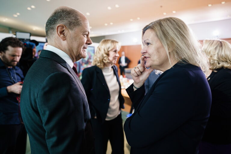 epa10399660 German Chancellor Olaf Scholz (L) and German Interior Minister Nancy Faeser talk during a cabinet meeting at the chancellery in Berlin, Germany, 11 January 2023. During its 46th session, the ministers and the chancellor of the German cabinet will discuss the bill to relaunch the digitization of the energy transition. EPA/CLEMENS BILAN