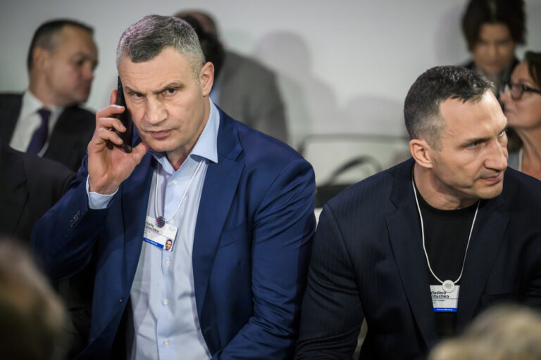 Kiyv Mayor Vitalii Klitschko, left, and his brother Wladimir Klitschko, right, react during the 53rd annual meeting of the World Economic Forum, WEF, in Davos, Switzerland, Wednesday, January 18, 2023. The meeting brings together entrepreneurs, scientists, corporate and political leaders in Davos under the topic 