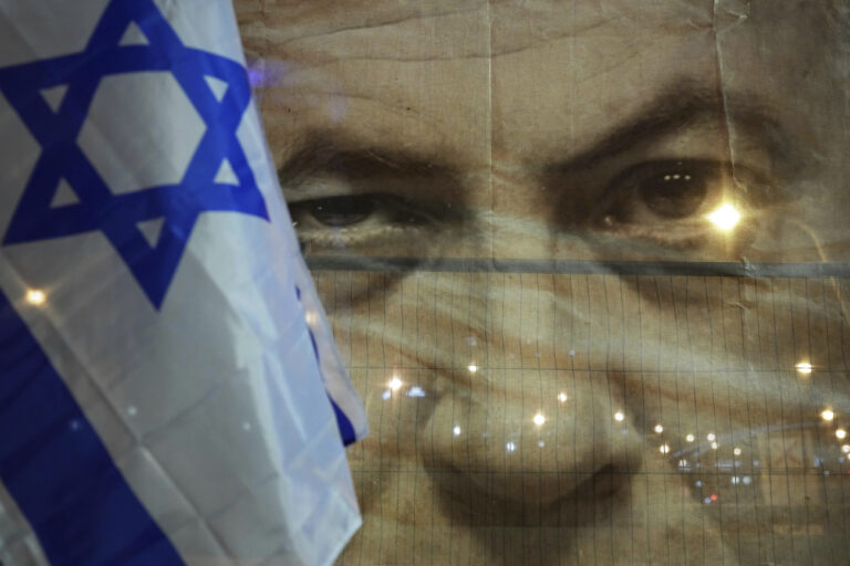 A banner depicting Israeli Prime Minister Benjamin Netanyahu during a protest against his far-right government, in Tel Aviv, Israel, Saturday, Jan. 21, 2023. Last week, tens of thousands of Israelis protested Netanyahu's government that opponents say threaten democracy and freedoms. (AP Photo/ Tsafrir Abayov)