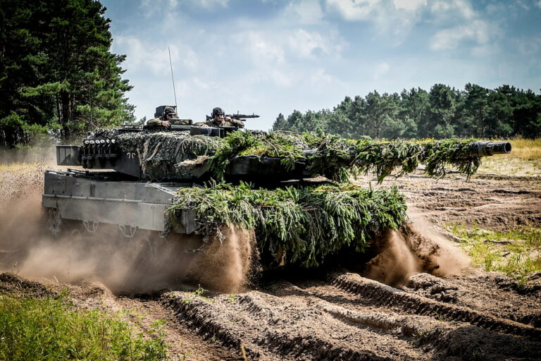 epa10427182 (FILE) - Soldiers of the German Bundeswehr practice with a 'Leopard 2 A6' battle tank in a combat exercise of the armoured brigade 21 'Lipperland', at the military training area of the General Field Marshal Rommel barracks in Augustdorf, Germany, 11 August 2021 (reissued 24 January 2023). German Chancellor Olaf Scholz has decided to send Leopard 2 tanks to Ukraine and allow other countries such as Poland to do so while the US may supply Abrams tanks, German media has reported 24 January 2023. EPA/SASCHA STEINBACH *** Local Caption *** 57112383